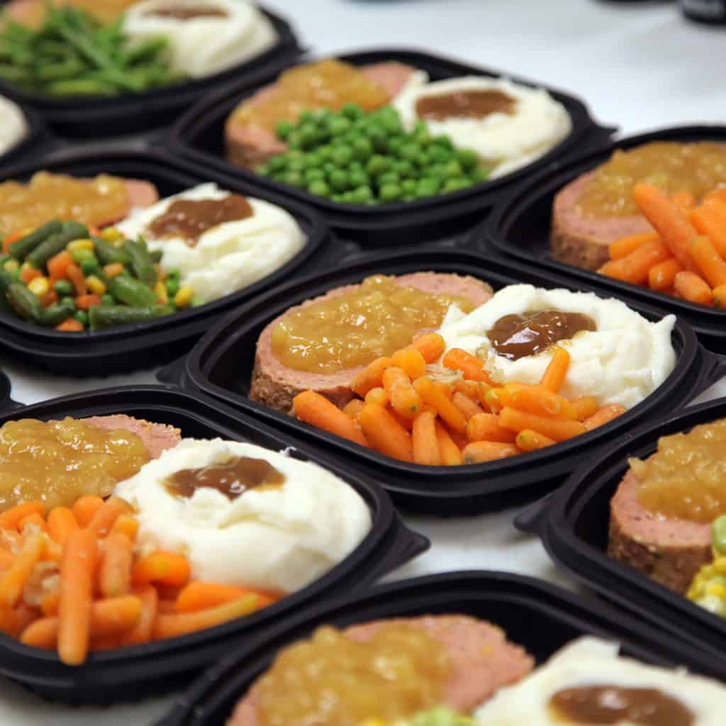 Take out and to go from the Shady Maple Farm Market packaged in individual black containers.